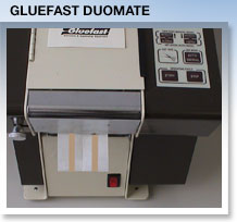 DUOMATE shown dispensing  a pair of two inch lines of glue.